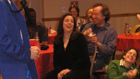 Adults in the audience laugh and applaud during a Chicago area comedy magic show!
